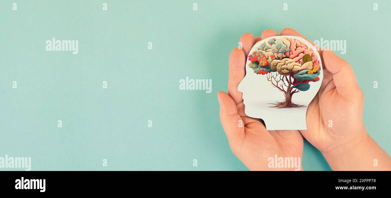 Hands holding paper head, human brain with flowers, self care and ...