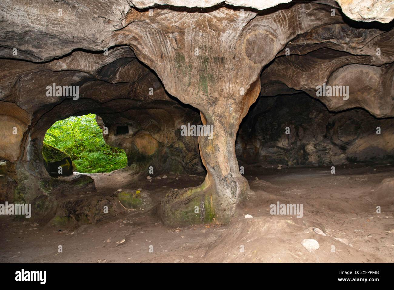 Huel Lee or Hohllay on the Mullerthal trail in Luxembourg, open cave with view to the forest, sandstone rock formation Stock Photo