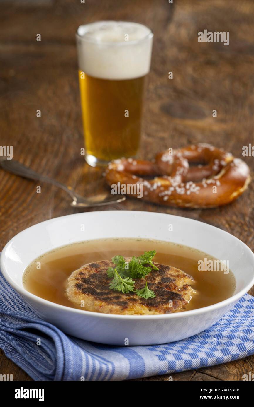 Austrian cheese dumpling soup on wood Stock Photo