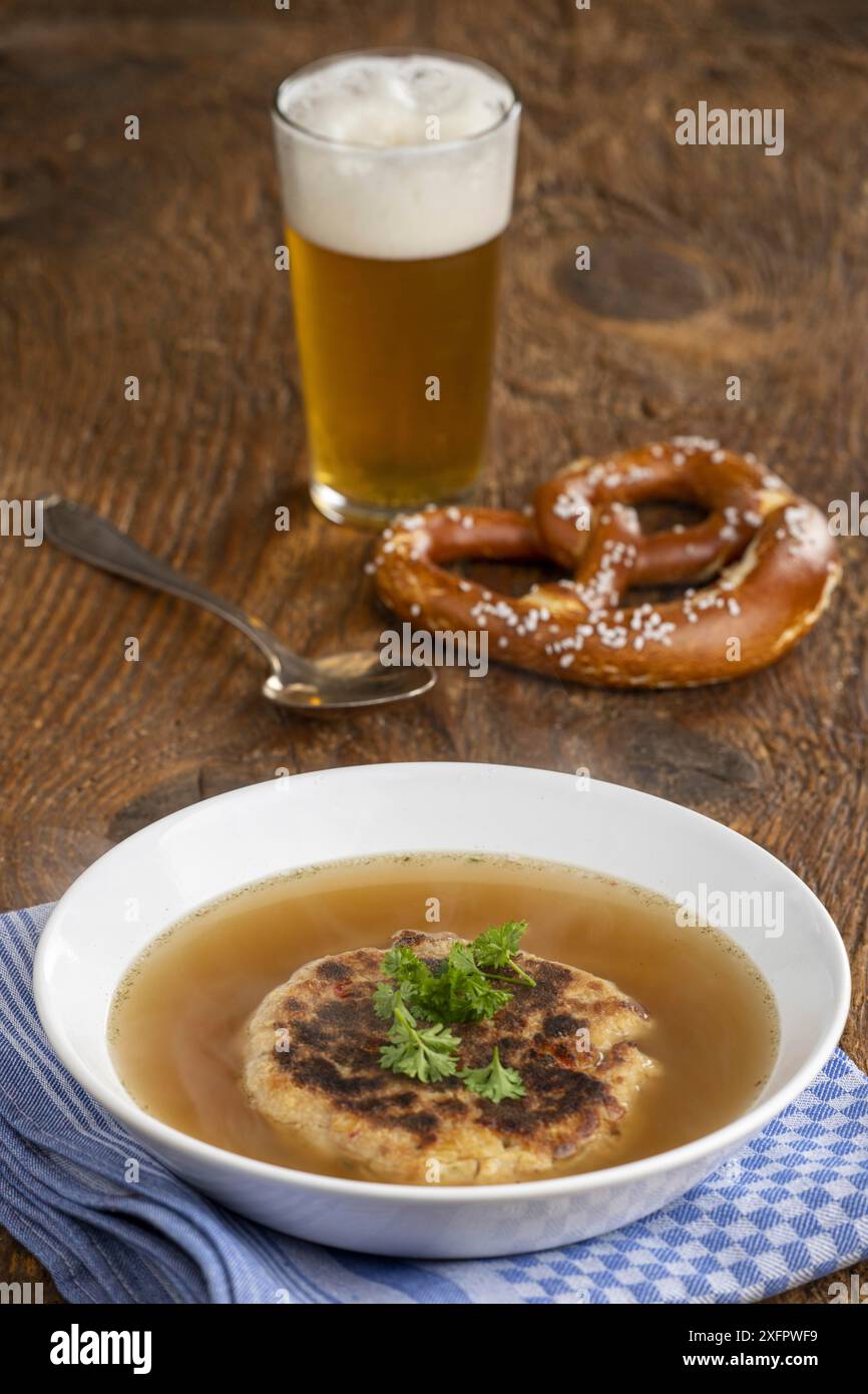 Austrian cheese dumpling soup on wood Stock Photo