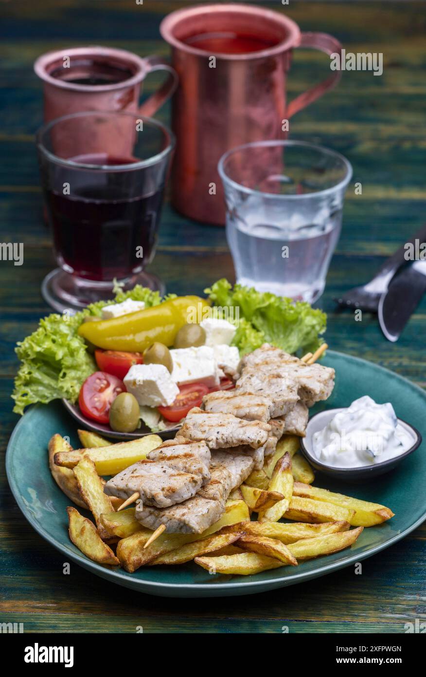 Greek souflaki with chips Stock Photo - Alamy