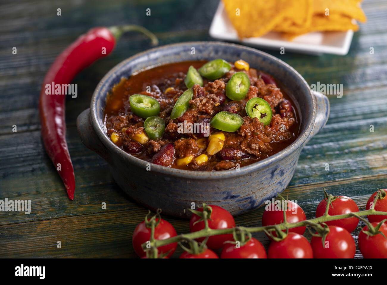Chilli con carne with nachos Stock Photo