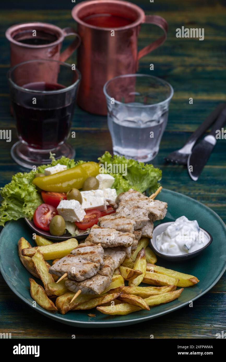Greek souflaki with chips Stock Photo - Alamy