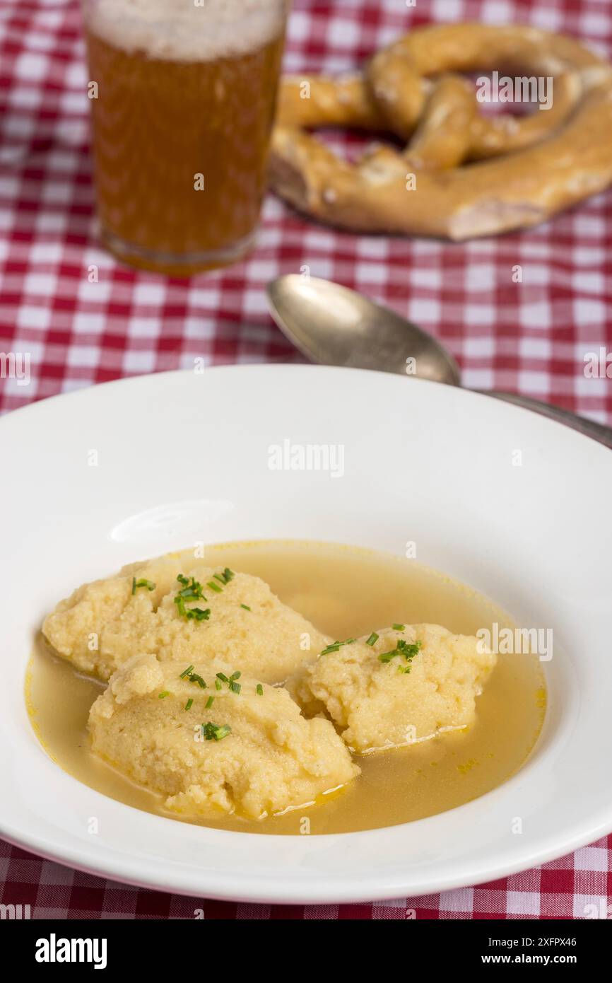 Bavarian dumpling soup on a tablecloth Stock Photo