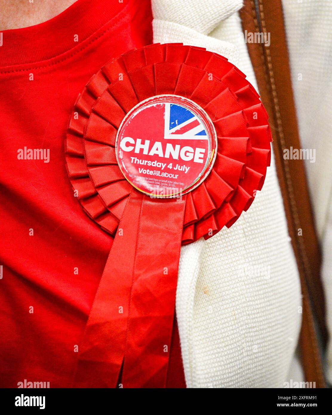 Brighton UK 5th July 2024 - A Labour Party Change  rosette at the Brighton & Hove General Election counts held in Portslade Sports Centre   : Credit Simon Dack / Alamy Live News Stock Photo