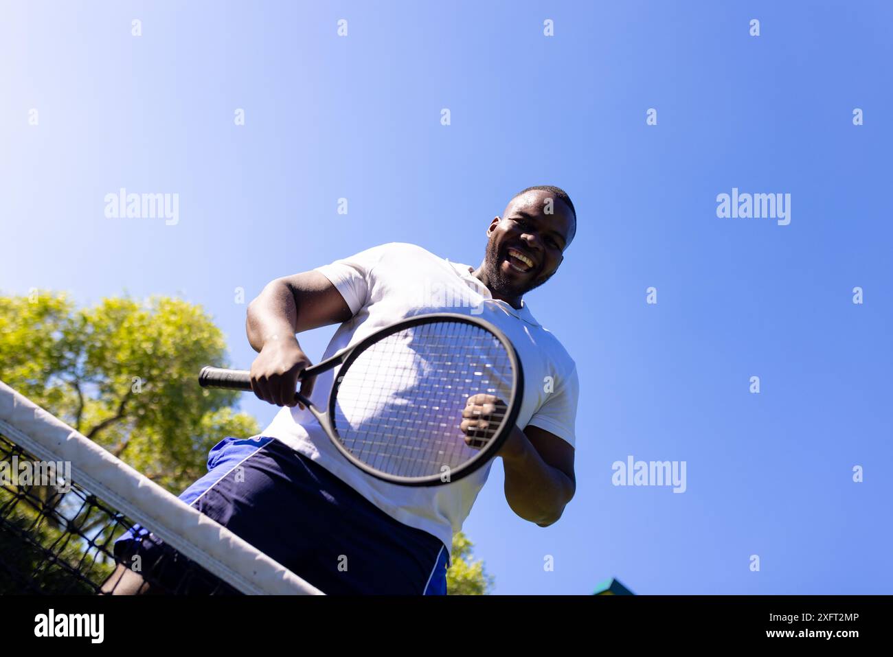 Man With Racket Man smiling tennis racket hi-res stock photography and images - Alamy