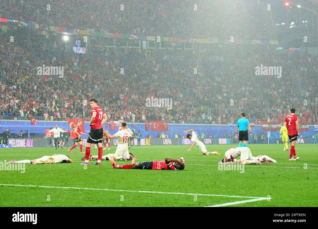 Michael Gregoritsch, AUT 11 Kevin Danso, AUT 4 , sad after final whistle ,  Salih Oezcan, Tuerkiye 15 celebrate in the best of 16 match AUSTRIA  - TueRKIJE 1-2 of the UEFA European Championships 2024  on Jul 02, 2024  in Leipzig, Germany.  Photographer: ddp images / star-images Stock Photo