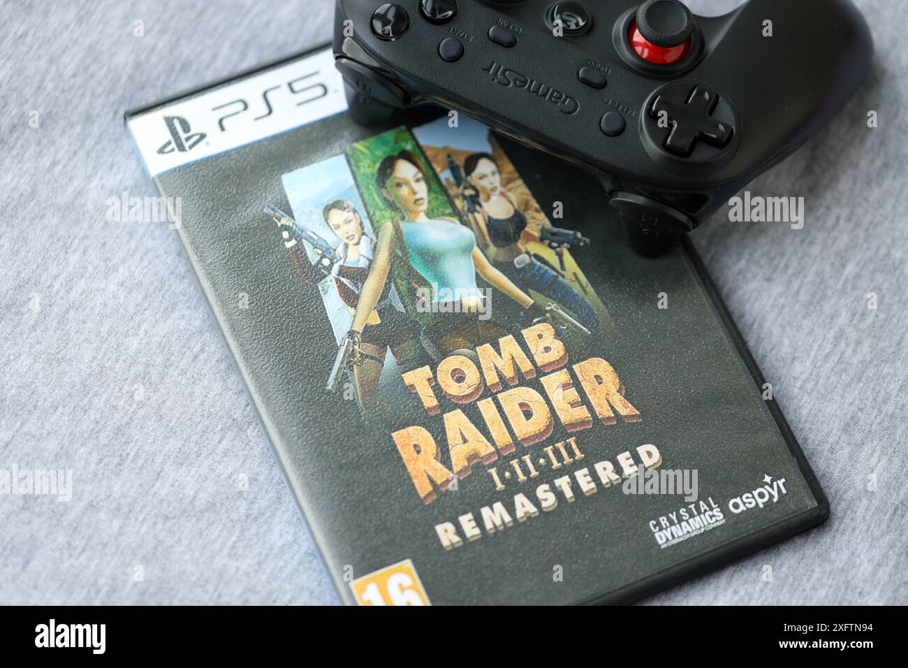 KYIV, UKRAINE JUNE 26, 2024 Tomb Raider 123 Remastered PS5 video game disc box for console