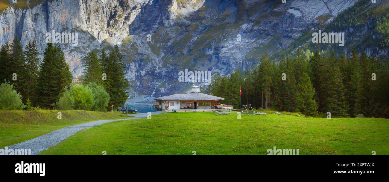 Oeschinnensee lake, wooden chalet and Swiss Alps, Berner Oberland ...