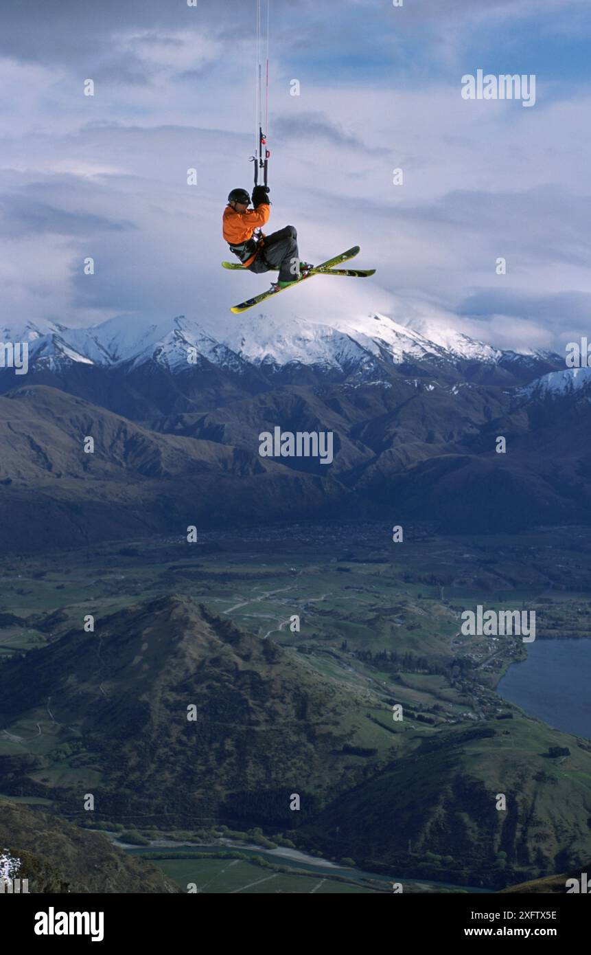 Man hovering in air from snow kite Stock Photo - Alamy