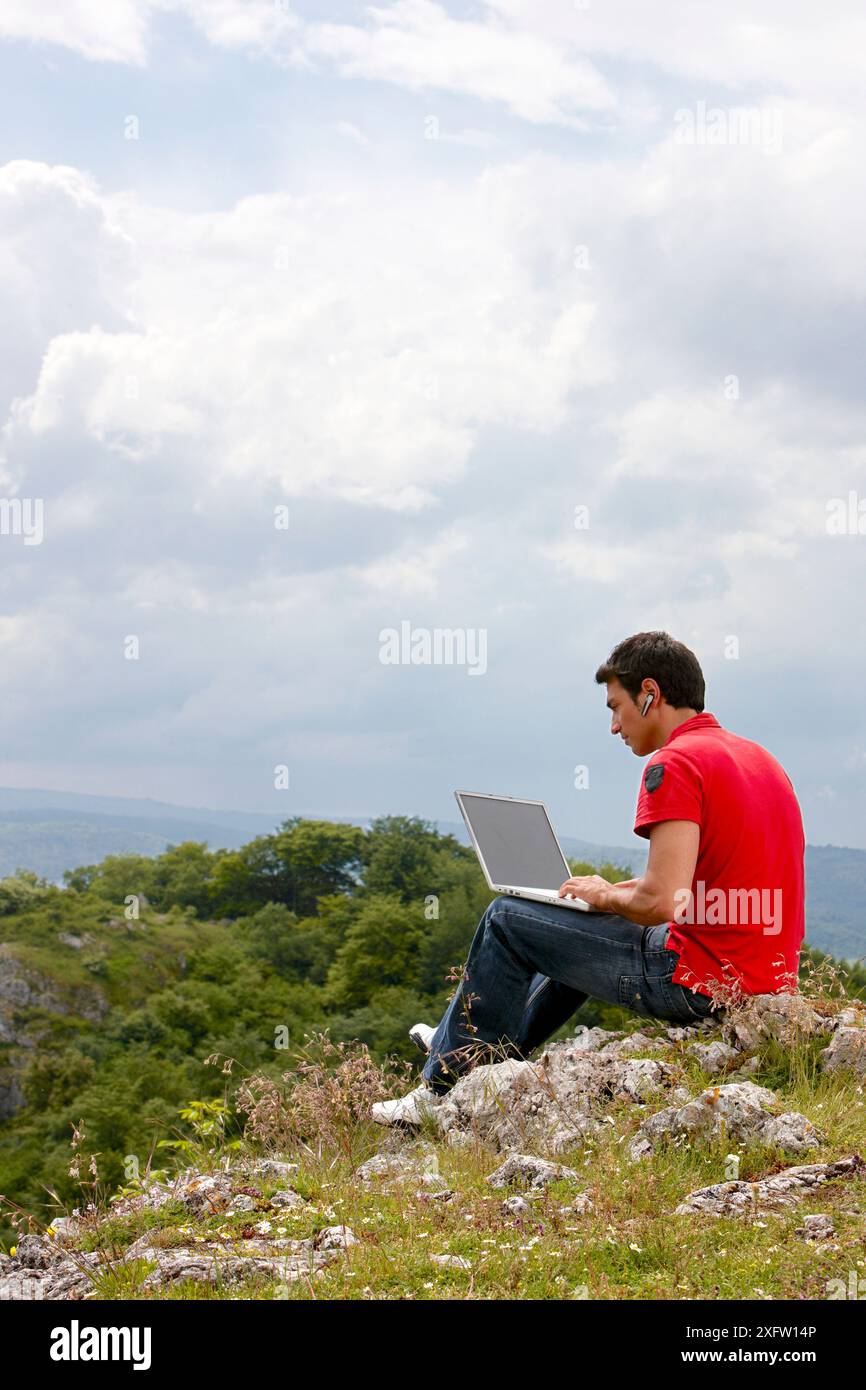 Young man using laptop computer, Murguia, Alava, Euskadi, Spain Stock Photo