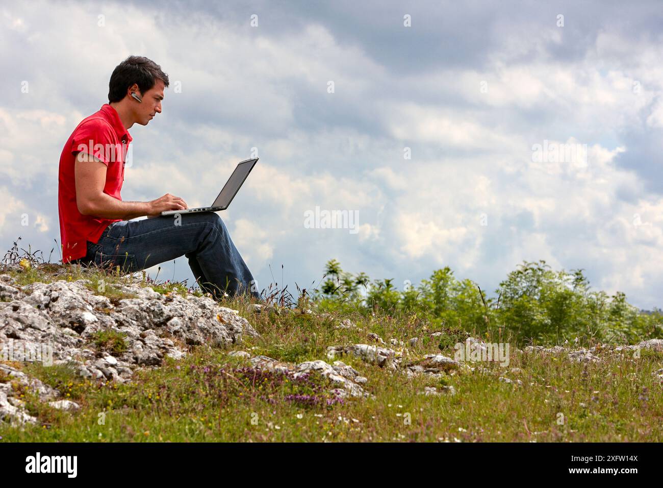 Young man using laptop computer, Murguia, Alava, Euskadi, Spain Stock Photo
