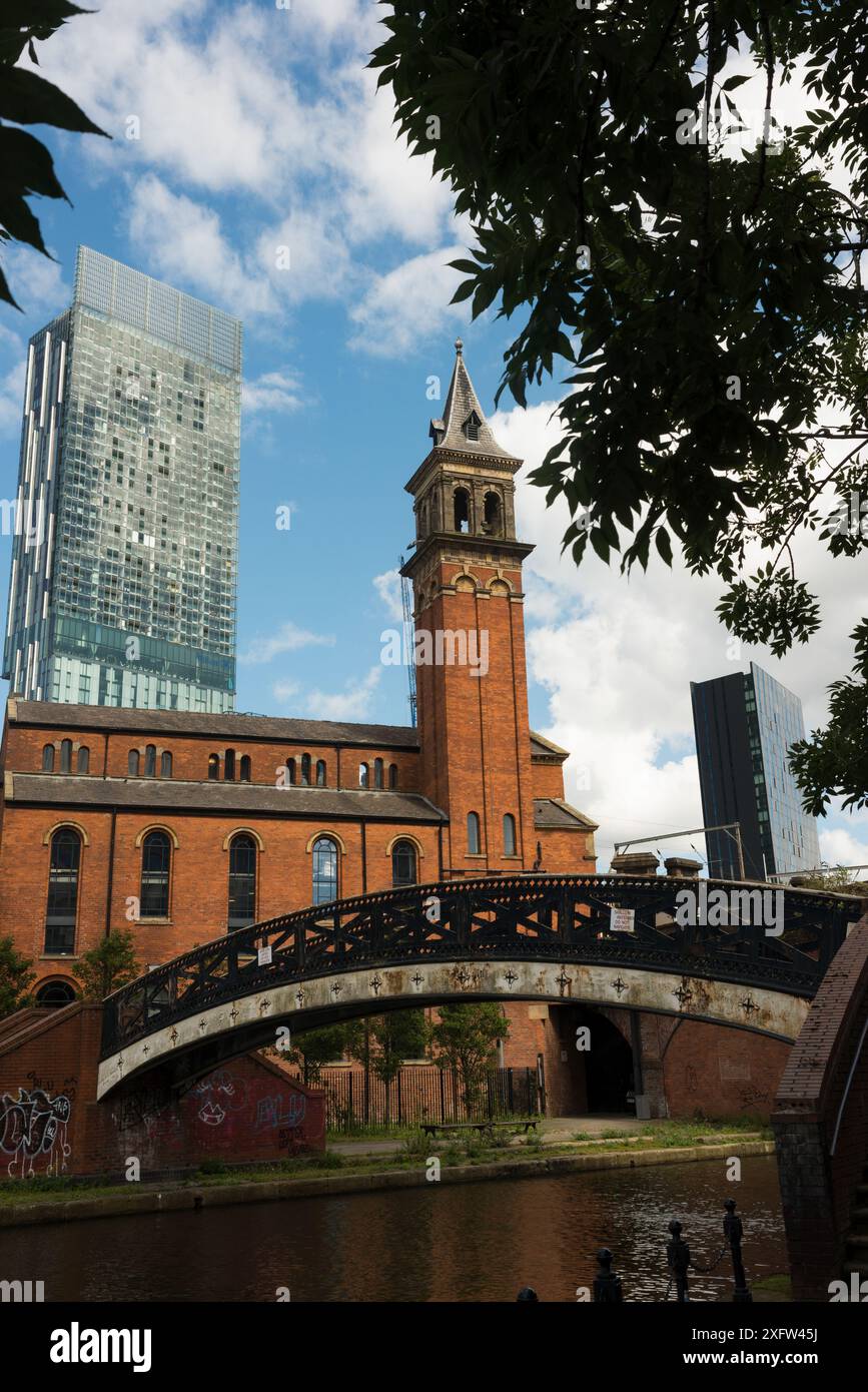 Castlefield Congregational Chapel next to the Bridgewater canal with modern offices in the background Stock Photo
