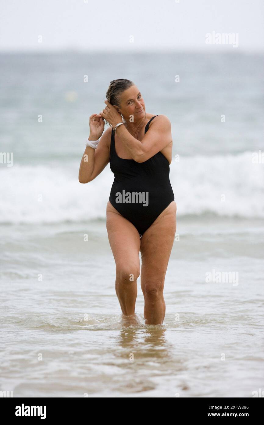 60-65 year old woman on beach. La Concha, San Sebastián, Euskadi, Spain Stock Photo