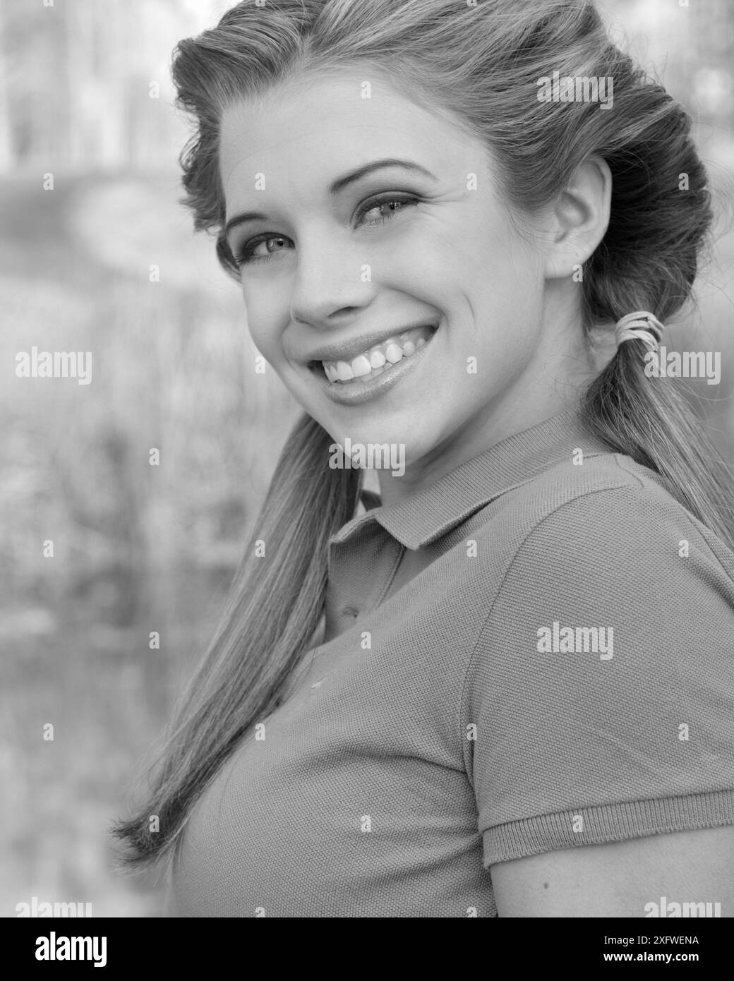 Closeup of Caucasian teen girl from 15 to 17 years smiling. Front view. USA Stock Photo