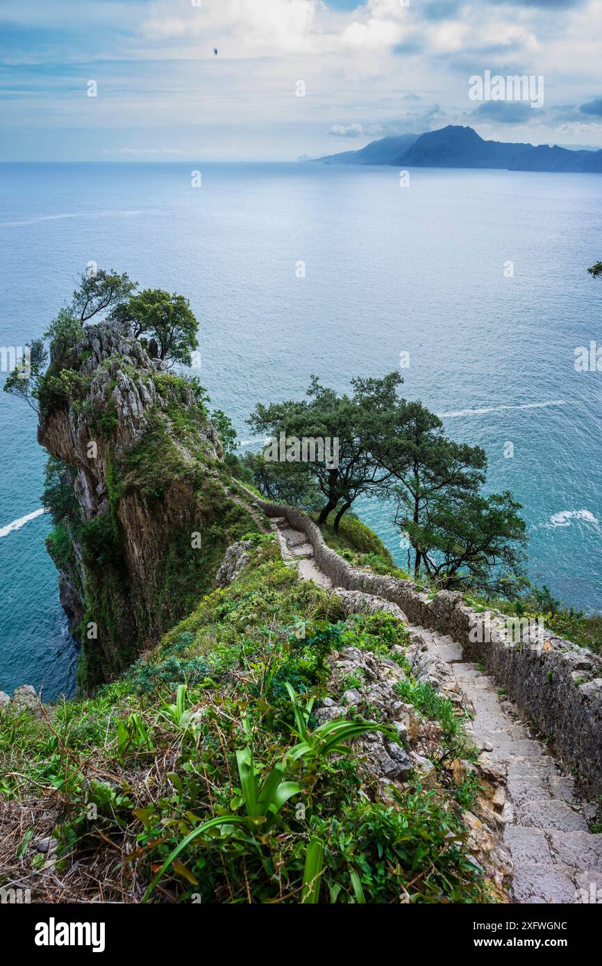 ascent of the stairs of Del Caballo lighthouse, Buciero mountain, Santoña, Cantabria, Spain. Stock Photo