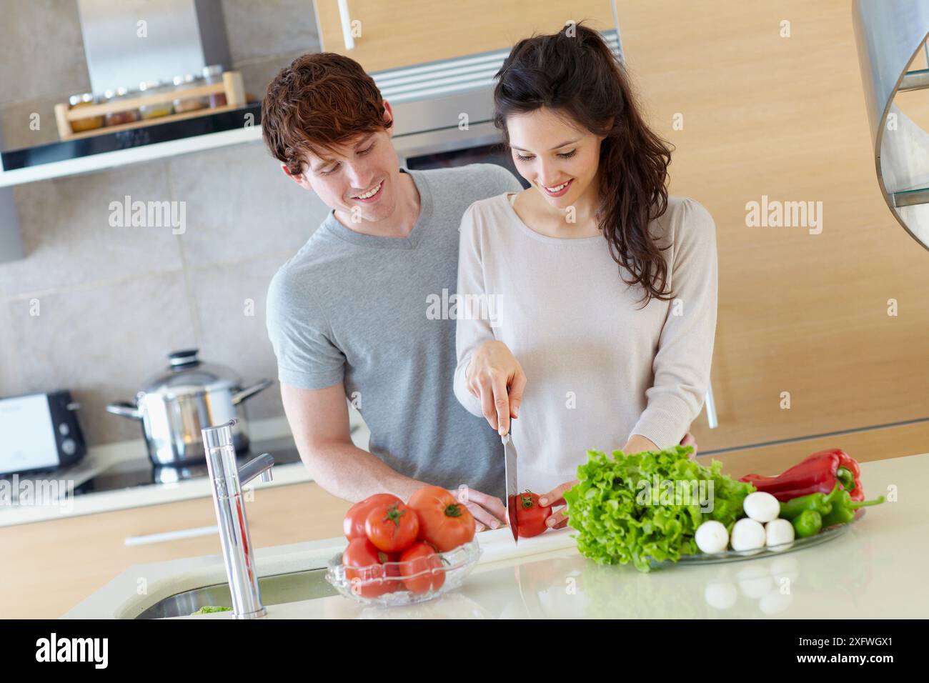Young couple in kitchen Stock Photo