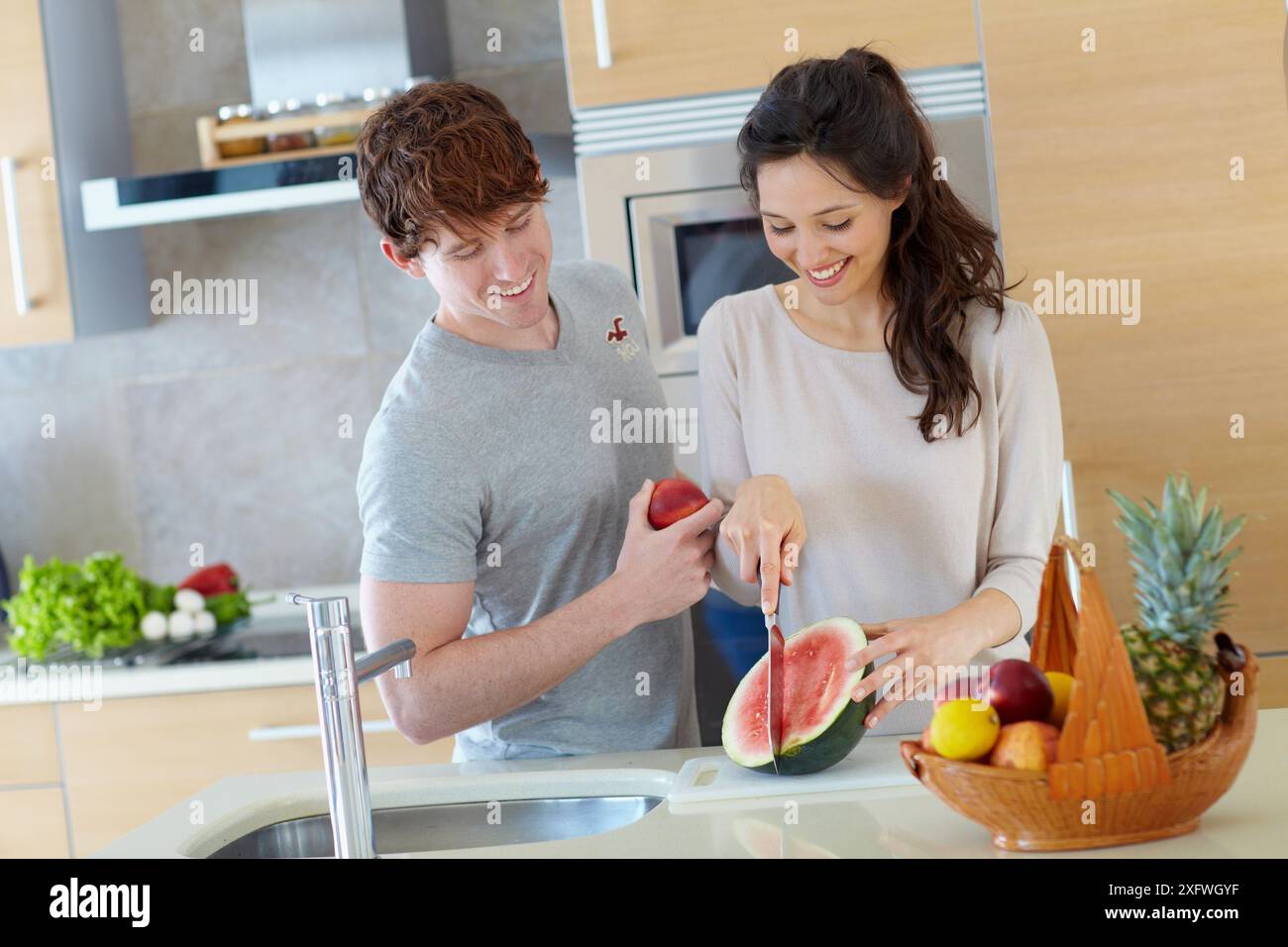 Young couple in kitchen Stock Photo