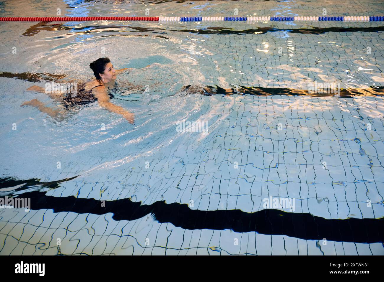 Mature woman swimming pool inside hi-res stock photography and images ...