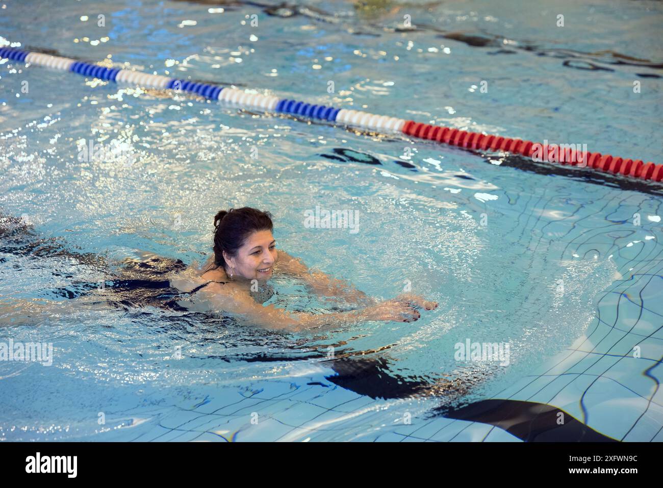 Mature woman swimming hi-res stock photography and images - Alamy