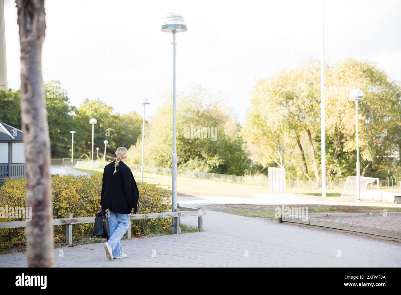 Back view teen girl walking hi-res stock photography and images - Alamy