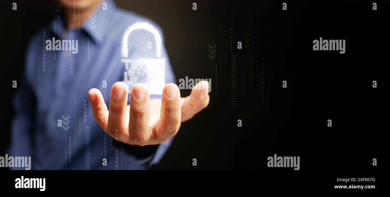 Cybersecurity technology. A man using virtual digital padlock to protect and grant access to his personal data or cyber security. Safe and secure inte Stock Photo
