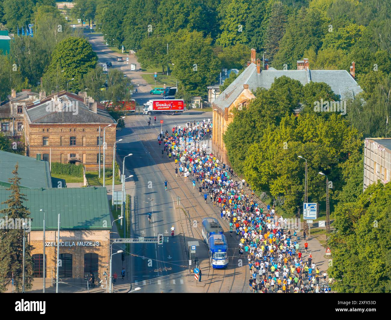 Aerial View of Runners in Riga Rimi Marathon 2024 with City Skyline ...
