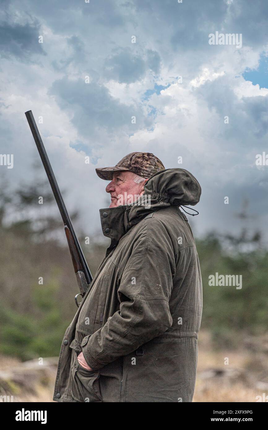 older white man with shotgun Stock Photo