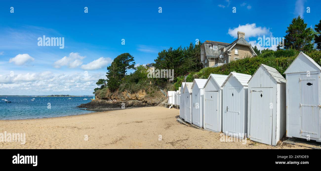 Vintage white beach cabins on Grande Salinette beach in Saint-Briac-sur ...