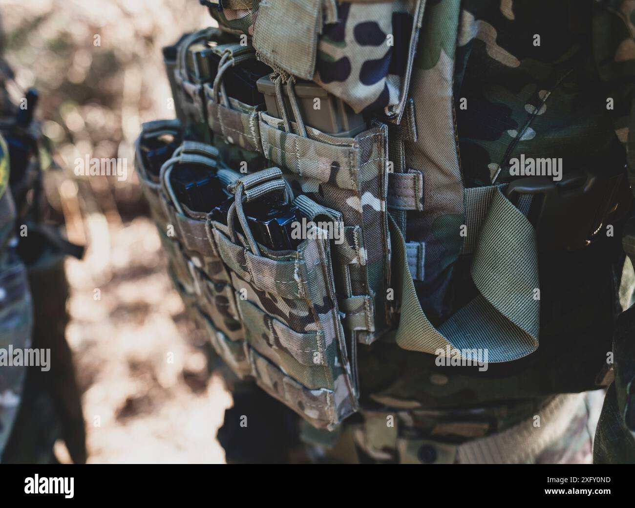 Airsoft military game. Chargers for compressed air guns. Selective focus. Stock Photo