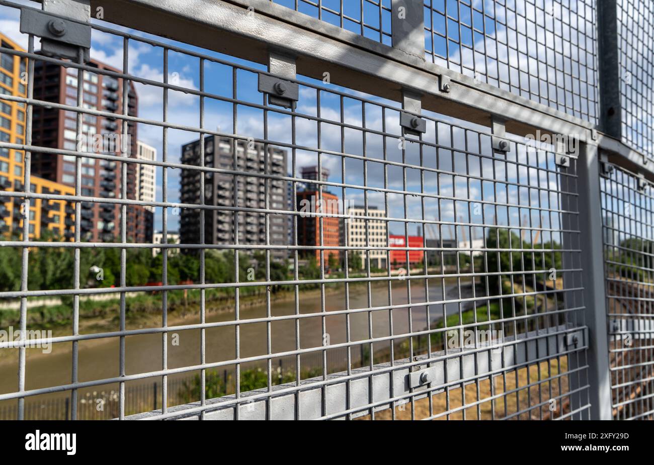 Docklands Light Railway (DLR ) train with Canary Wharf buildings in ...