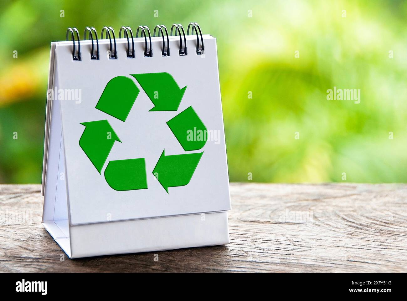 Recycle symbol on with notepad with blur nature background. Recycle ...