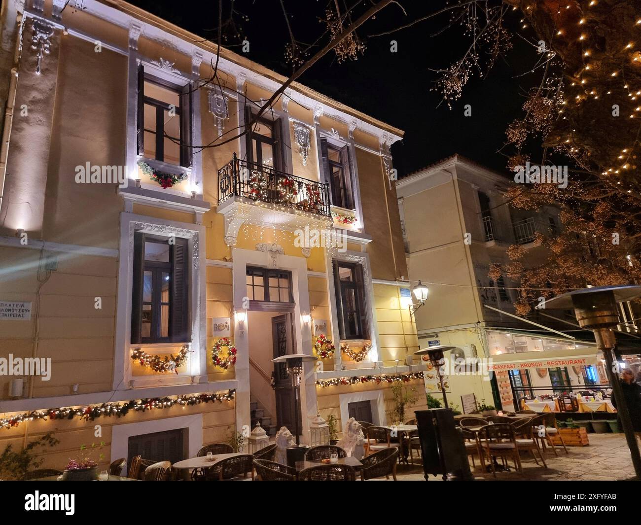 Restaurants abound in the central square of Platonas, Athens, welcoming ...