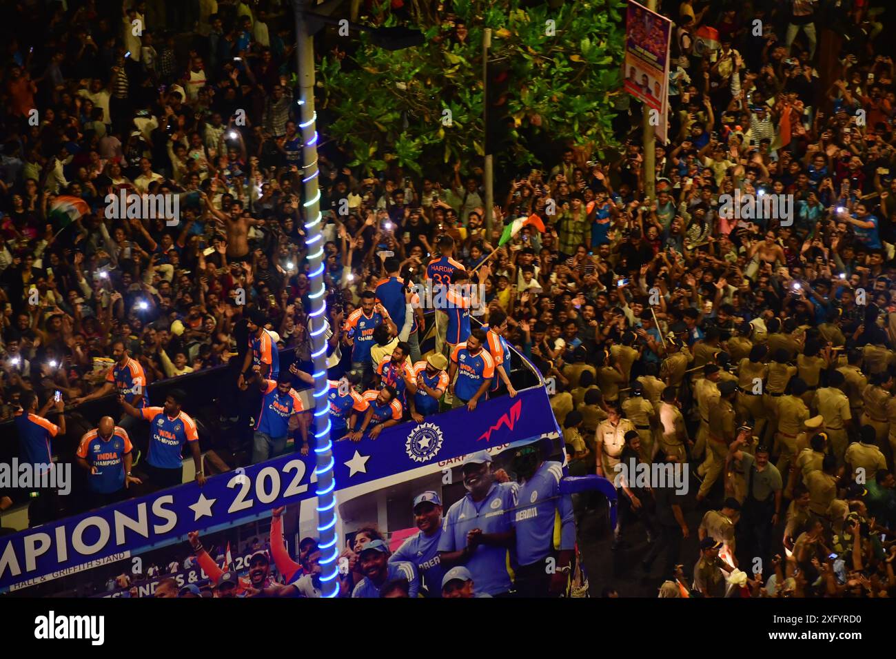 MUMBAI, INDIA - JULY 4: Indian cricketers gesture during an open bus