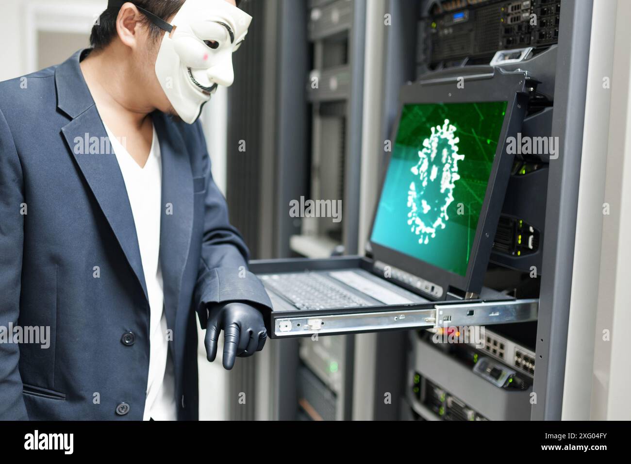 Masked Hacker in Computer Server room Concept .Editorial photo Stock Photo
