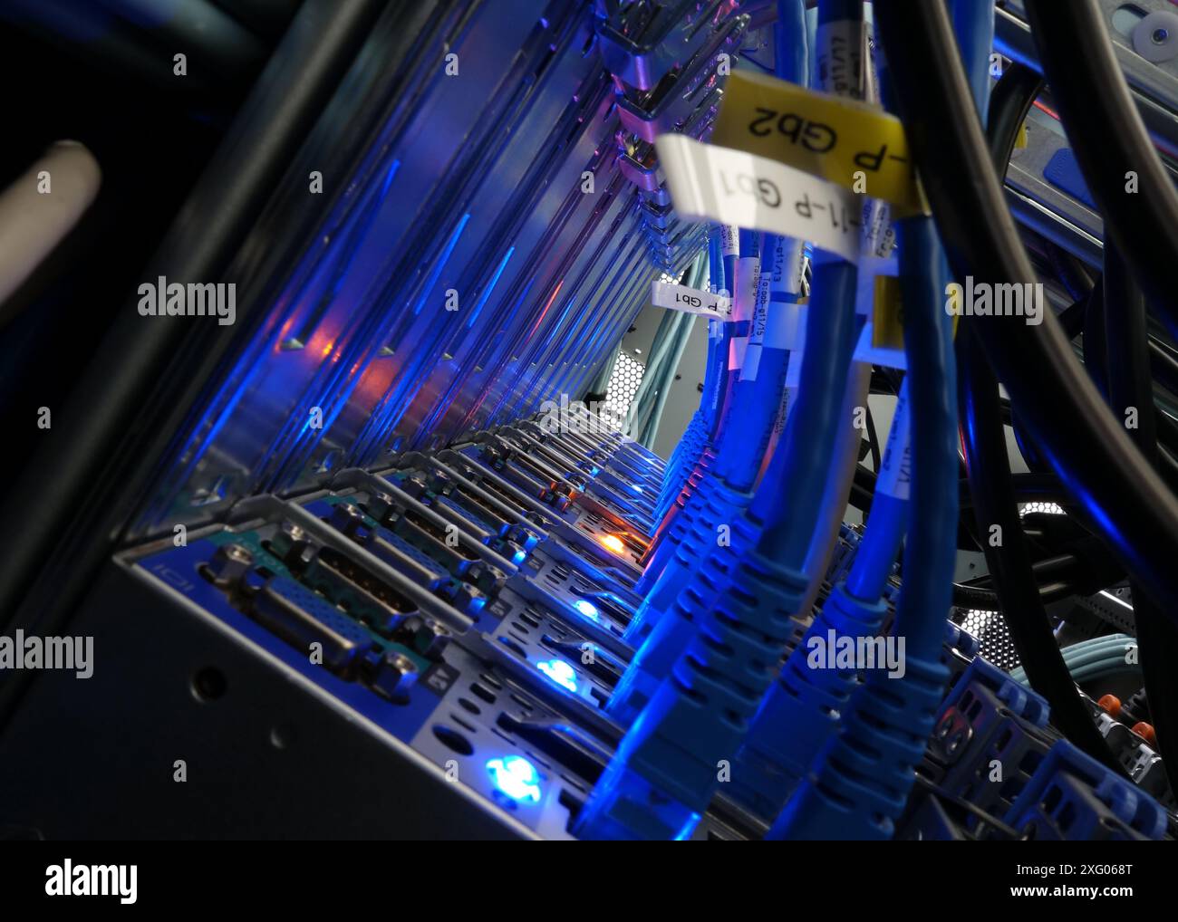 close up of network cables connected to server racks in data center ...