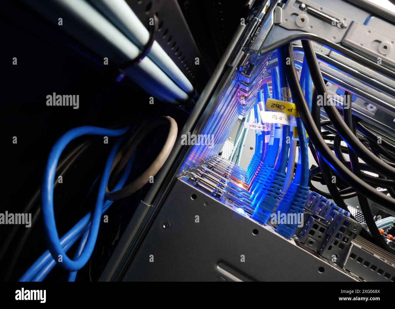 close up of network cables connected to server racks in data center ...