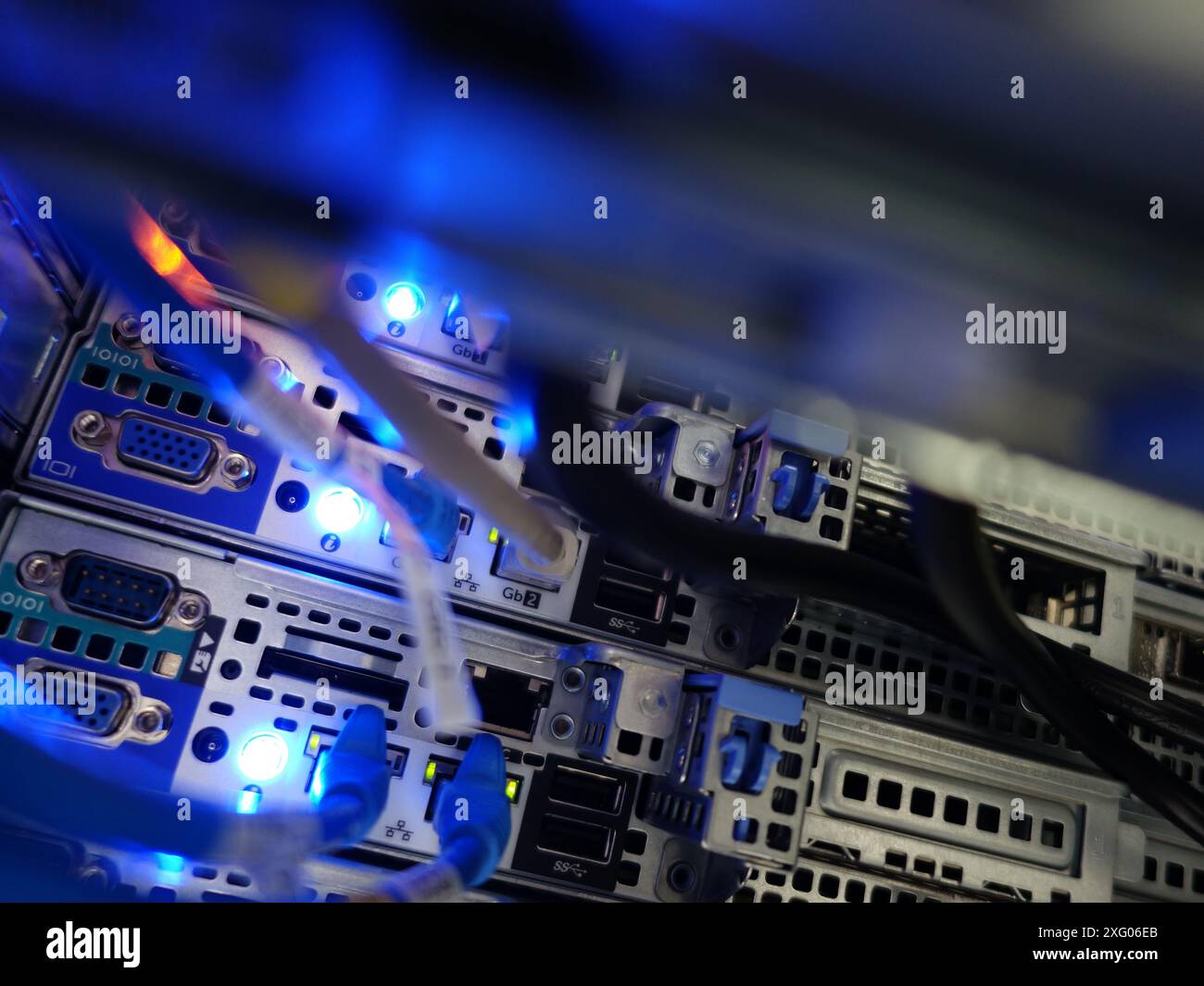 close up of network cables connected to server racks in data center ...