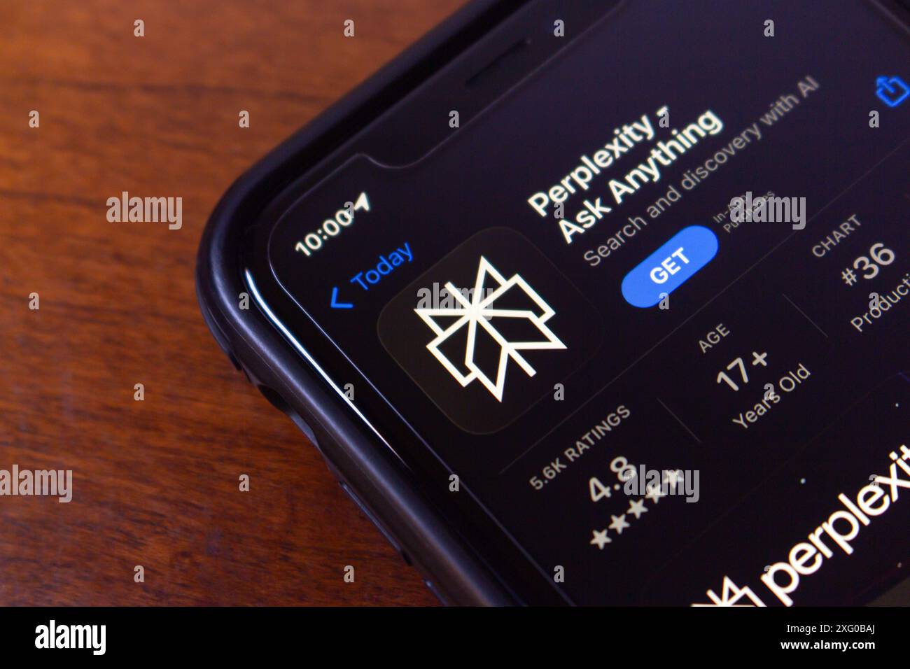 Perplexity.ai app seen in an App Store on an iPhone. Perplexity AI is a research and conversational search engine powered by AI chatbots. Stock Photo