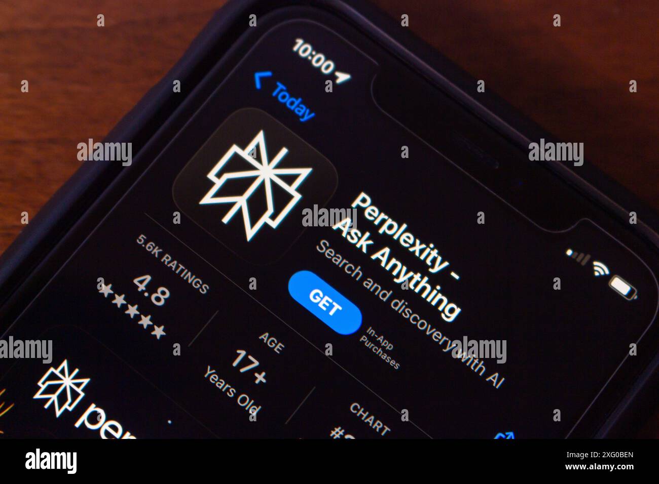Perplexity.ai app seen in an App Store on an iPhone. Perplexity AI is a research and conversational search engine powered by AI chatbots. Stock Photo