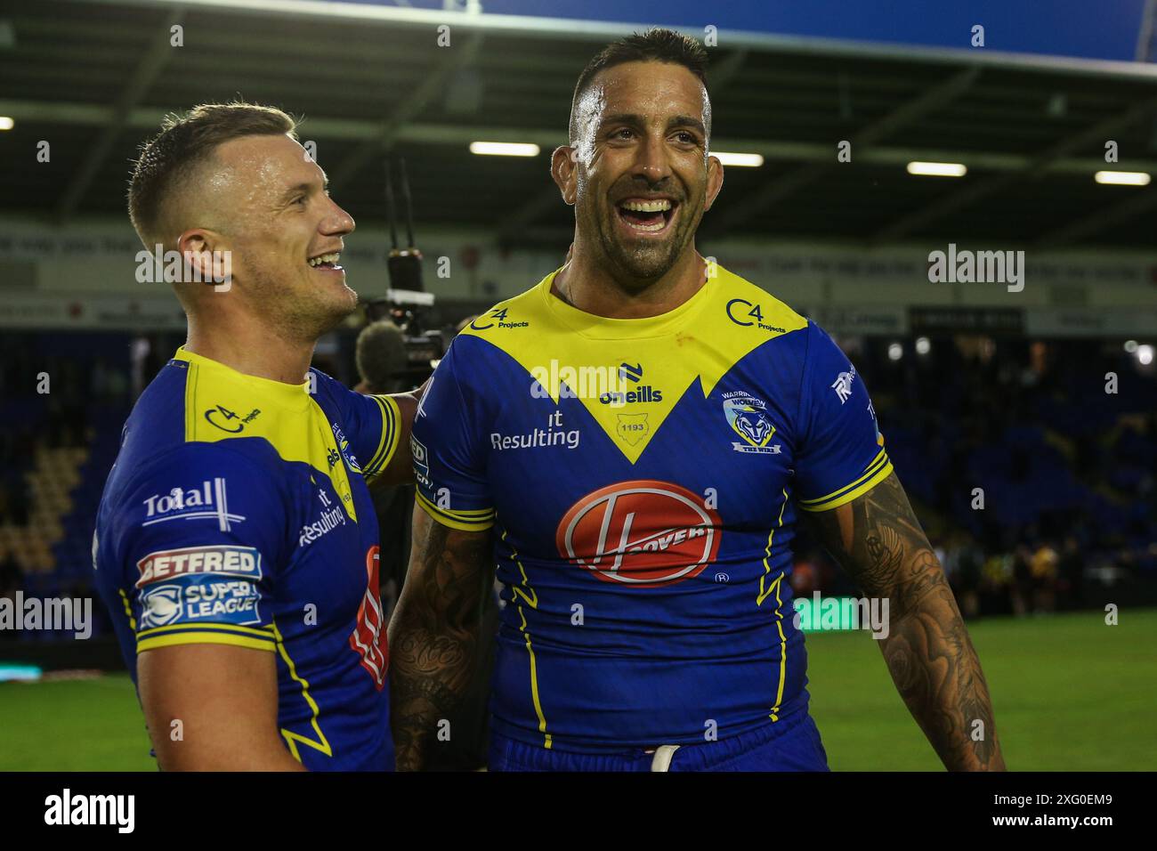 Josh Drinkwater of Warrington Wolves and Paul Vaughan of Warrington Wolves all smiles after their team’s 48-0 win after the Betfred Super League Round 16 match Warrington Wolves vs Huddersfield Giants at Halliwell Jones Stadium, Warrington, United Kingdom, 5th July 2024  (Photo by Gareth Evans/News Images) Stock Photo