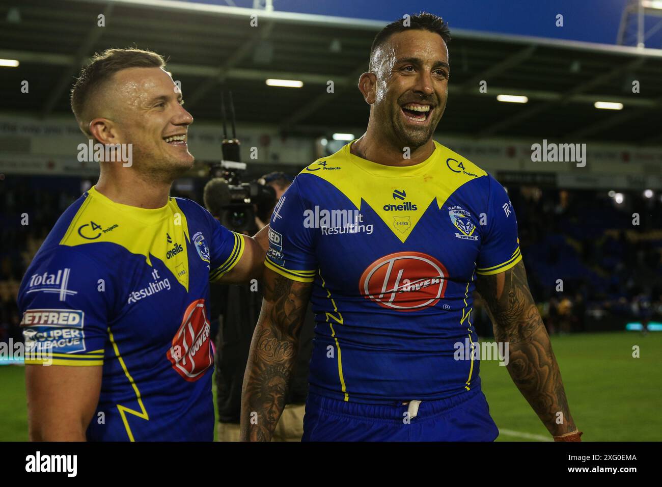 Josh Drinkwater of Warrington Wolves and Paul Vaughan of Warrington Wolves all smiles after their team’s 48-0 win after the Betfred Super League Round 16 match Warrington Wolves vs Huddersfield Giants at Halliwell Jones Stadium, Warrington, United Kingdom, 5th July 2024  (Photo by Gareth Evans/News Images) Stock Photo