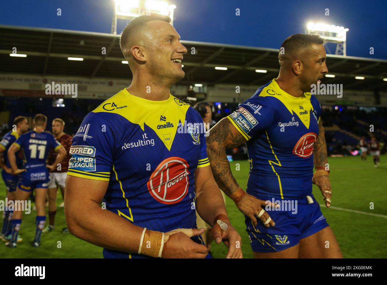 Josh Drinkwater of Warrington Wolves and Paul Vaughan of Warrington Wolves all smiles after their team’s 48-0 win after the Betfred Super League Round 16 match Warrington Wolves vs Huddersfield Giants at Halliwell Jones Stadium, Warrington, United Kingdom, 5th July 2024  (Photo by Gareth Evans/News Images) Stock Photo