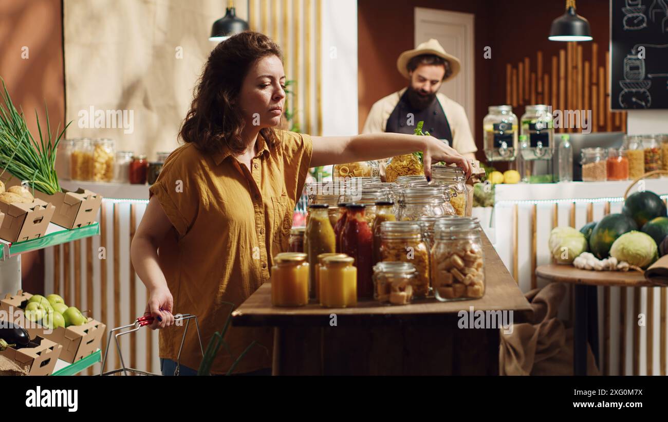 Vegan woman in specialty zero waste supermarket using shopping basket