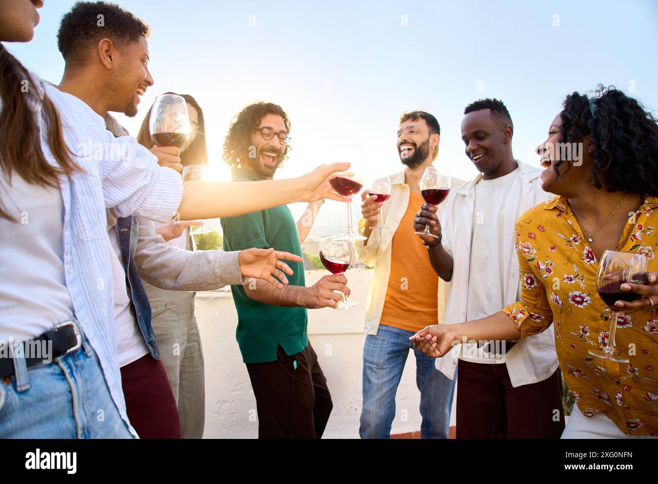 Group multiracial happy friends enjoying sunny day together dancing and ...