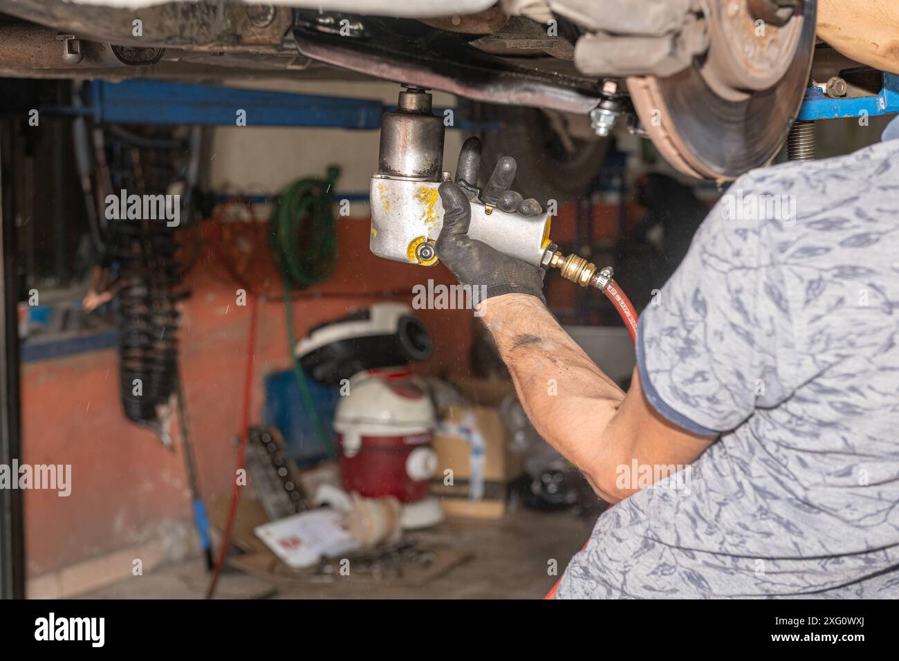 Mechanic working underneath machine hi-res stock photography and images ...