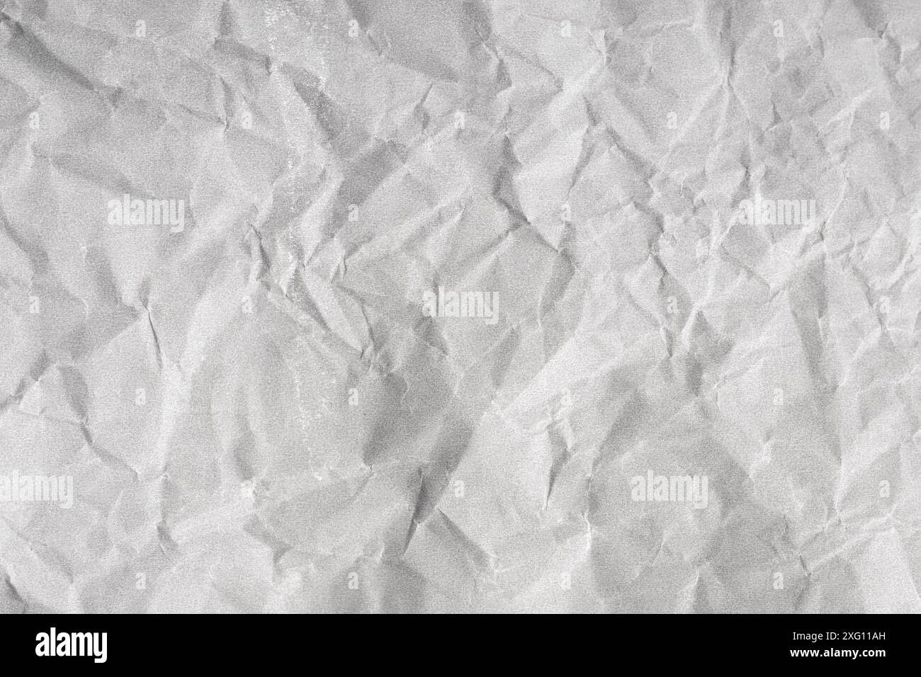 Creased paper background texture. Gray color. Full frame Stock Photo