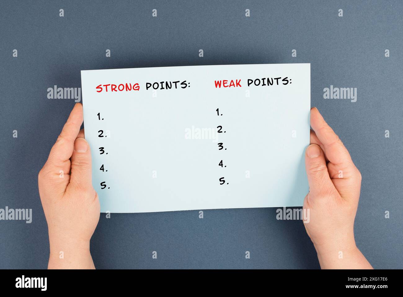 Holding a paper in the hands, list of weak and strong points, analysis ...