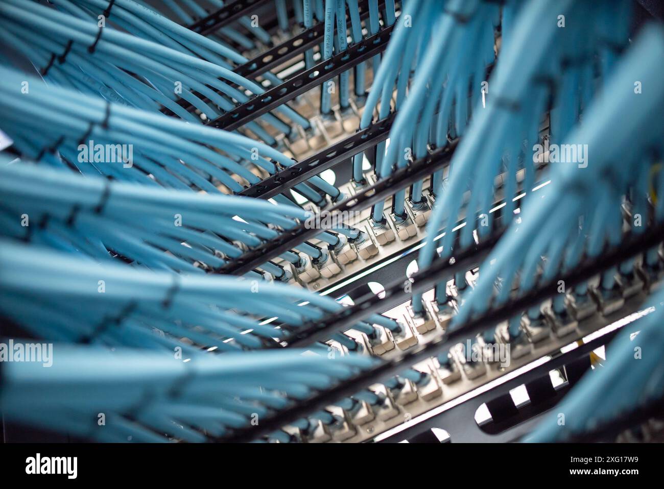 close up of network cables connected to server racks in data center ...