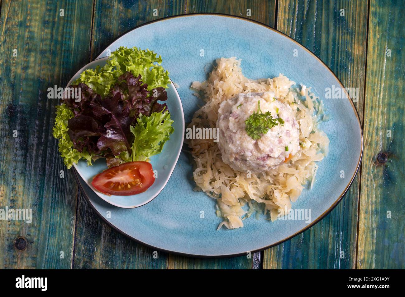 Bacon dumplings on sauerkraut Stock Photo